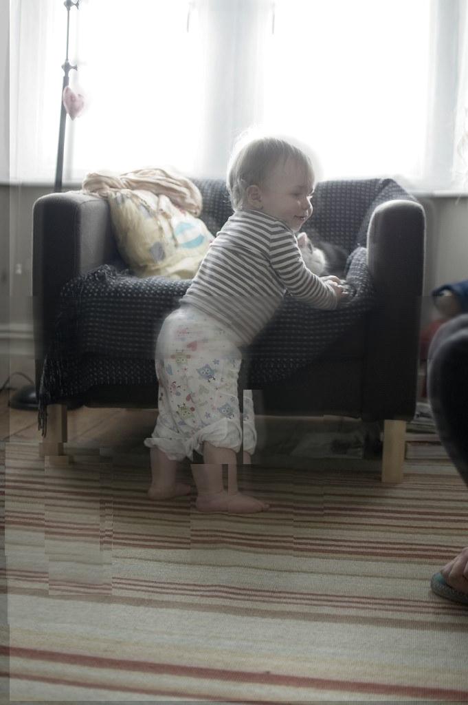 The same photograph of the toddler’s first steps, deliberately altered: the colour is drained, fragments repeat, and the child has too many feet. This version of the moment never happened.