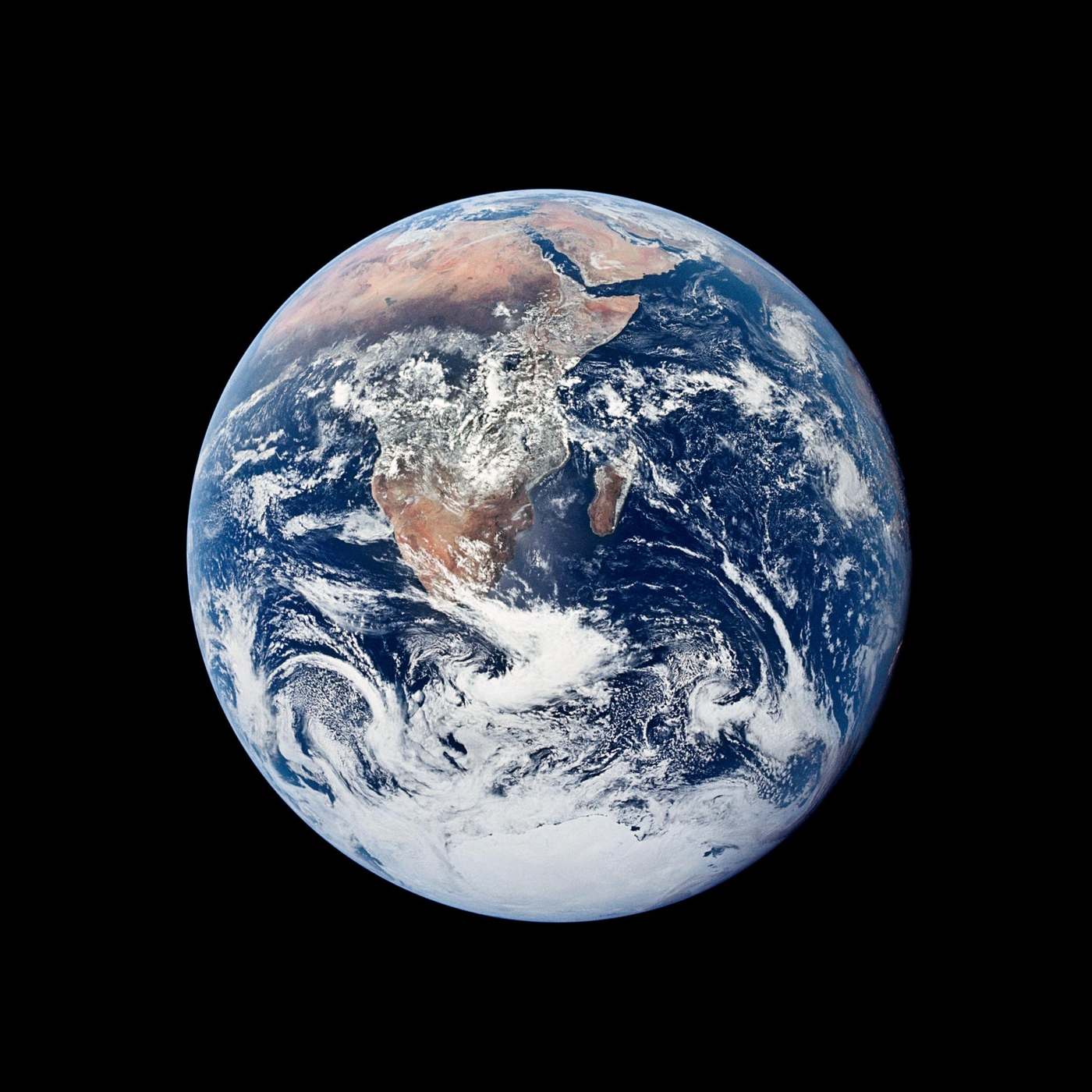 The Blue Marble: the whole Earth — ocean, Africa, Antarctica under swirling cloud — photographed by the crew of Apollo 17 on 7 December 1972.